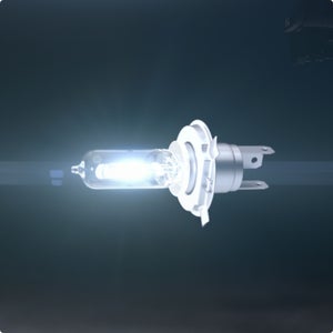 Close-up of a halogen headlight bulb in a darkened background.